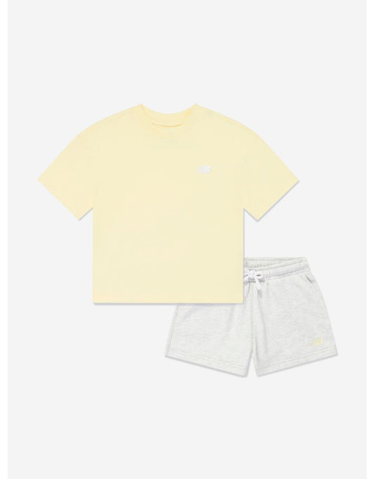 Set di maglietta e pantaloncini New Balance da bambina di colore giallo con logo piccolo