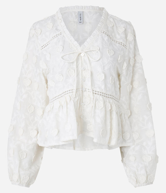 Blusa de batista con bordado 3D e inserciones blancas