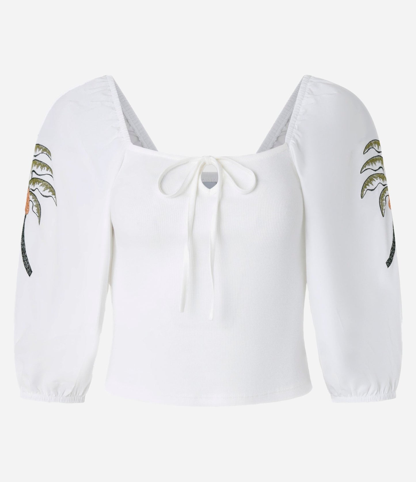 Blusa blanca de canalé con lazo y bordado tropical en las mangas
