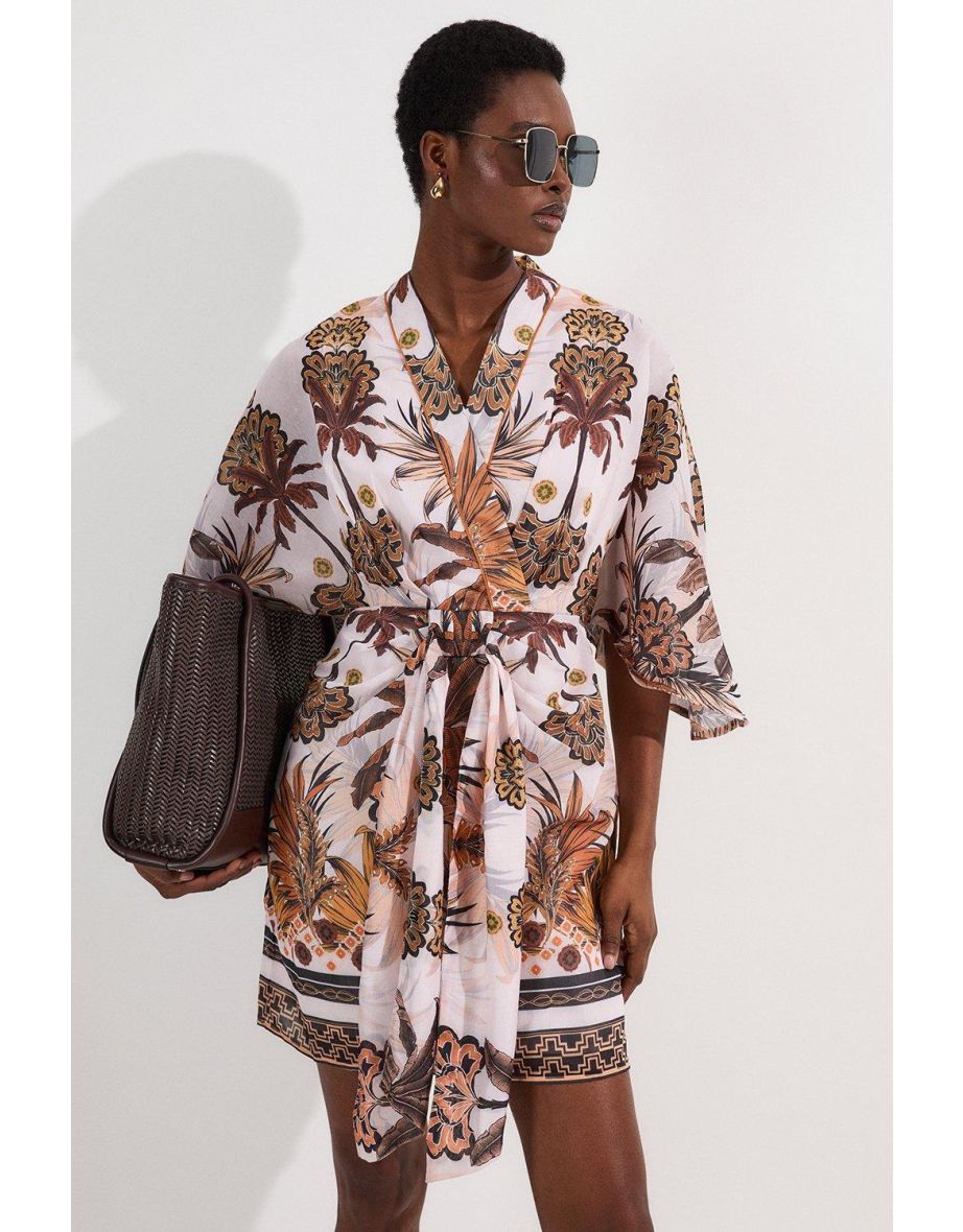 Mini abito in cotone con stampa astratta e maniche a kimono intrecciate