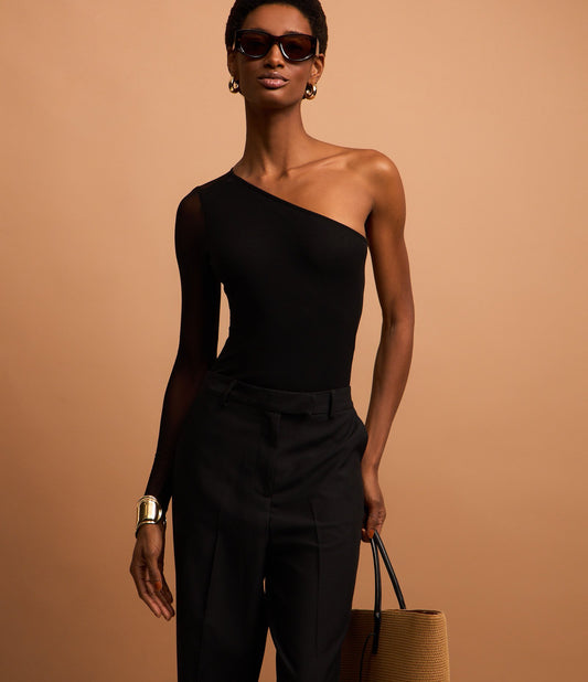 Body nero in tulle trasparente con monospalla e manica lunga