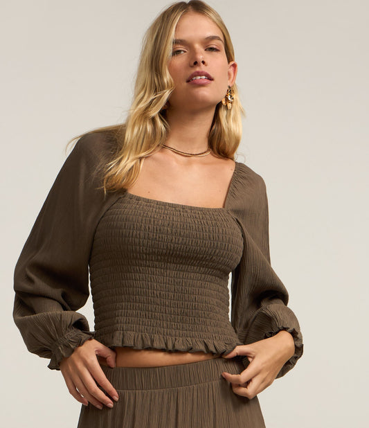 Blusa corta de crepé con mangas abullonadas y smocking verde