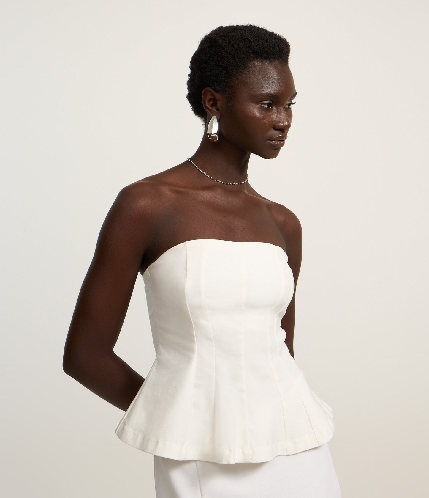 Top Peplum bianco senza spalline in tessuto bengalino