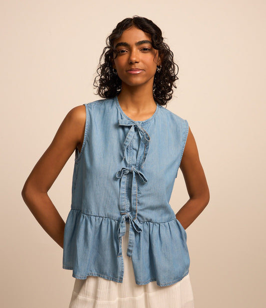 Blusa vaquera azul peplum con lazos
