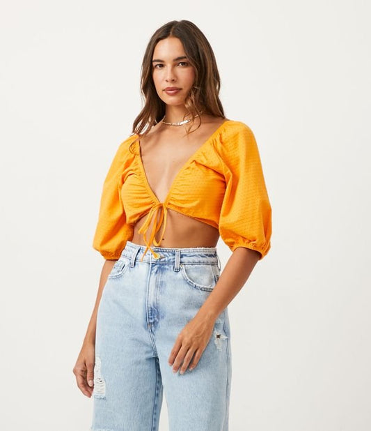 Blusa de algodón texturizado con mangas abullonadas en amarillo