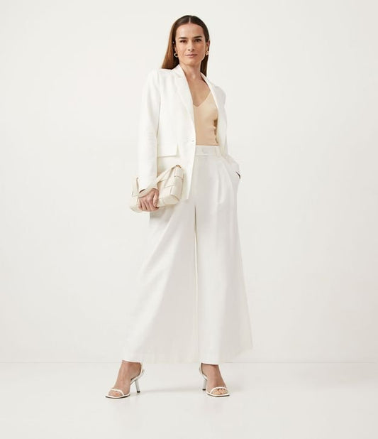 Pantalones de algodón con cintura ancha y pliegues delanteros en blanco