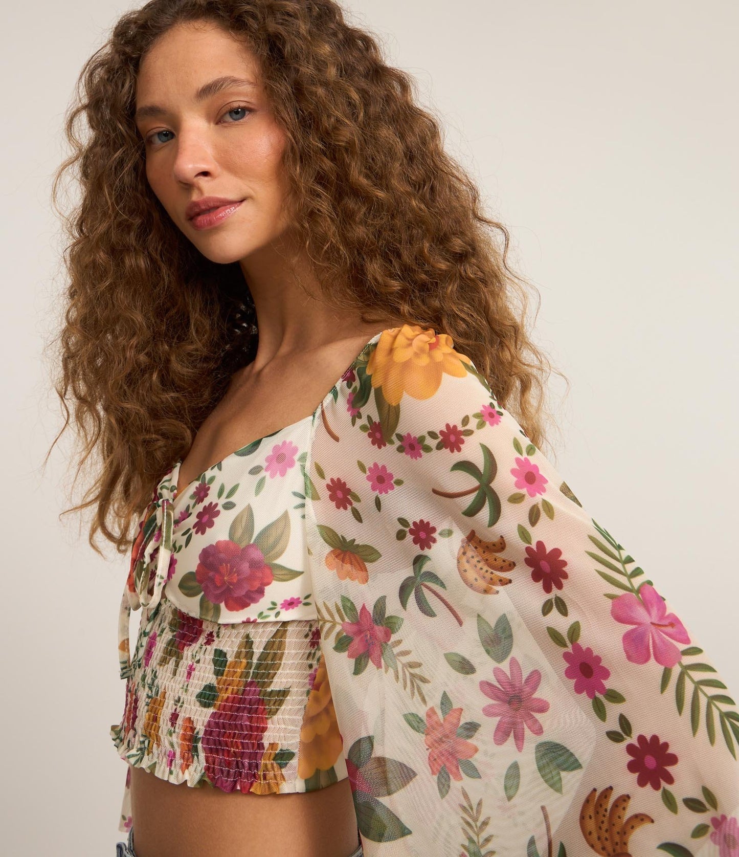 Tulle Blouse with Bow at Neckline, Floral Print, and Multicolored Smocked Hem