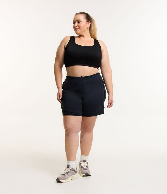 Corredor Deportivo Corto Negro Curvo y Tallas Grandes con Braguita Incorporada y Tecnología Seca