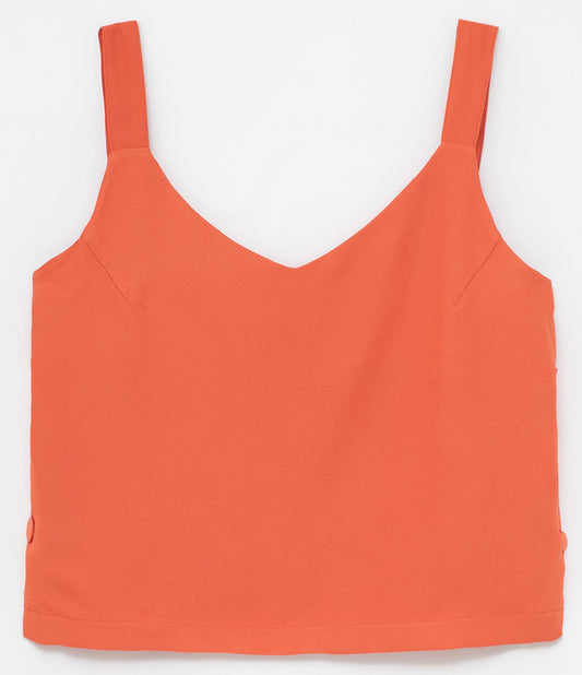 Top naranja sin mangas con botones laterales