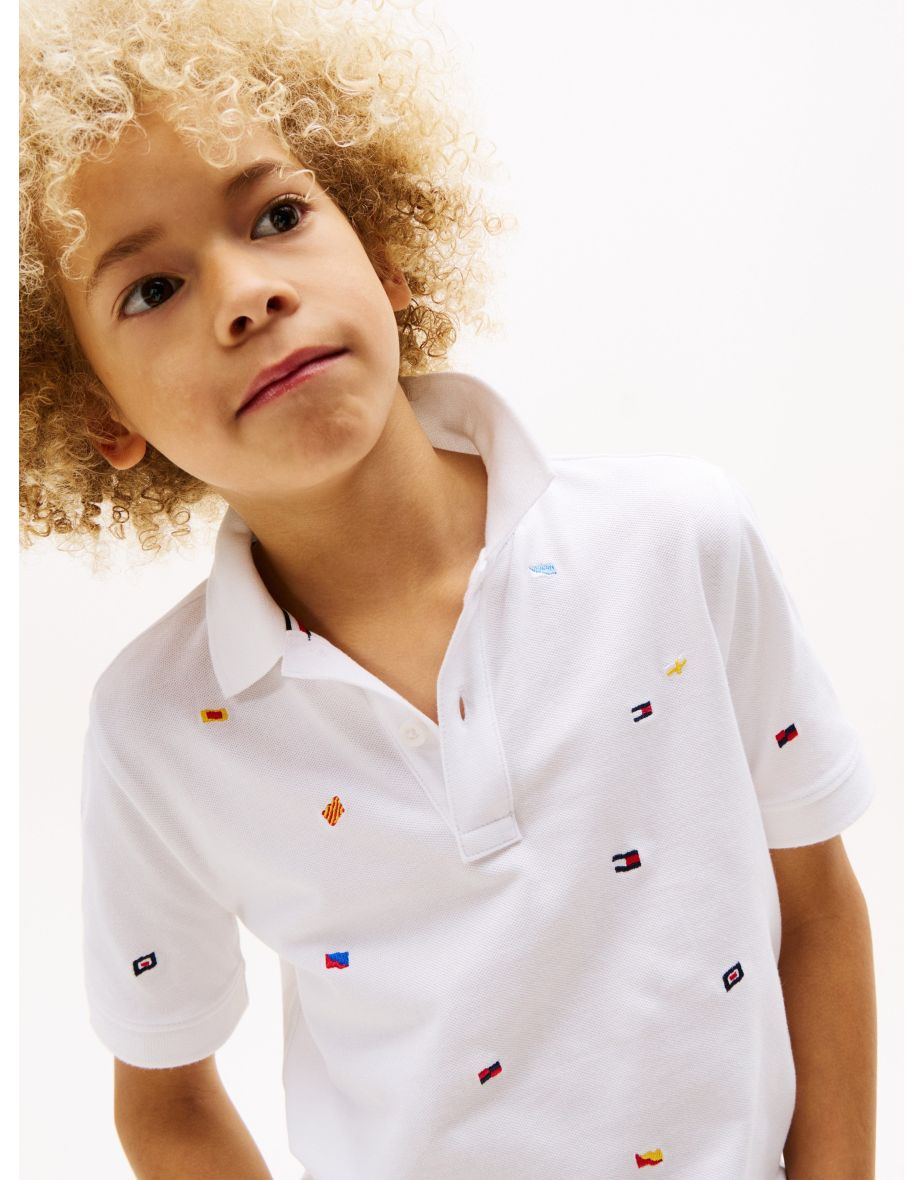 Polo blanco para niño con bordado de bandera integral