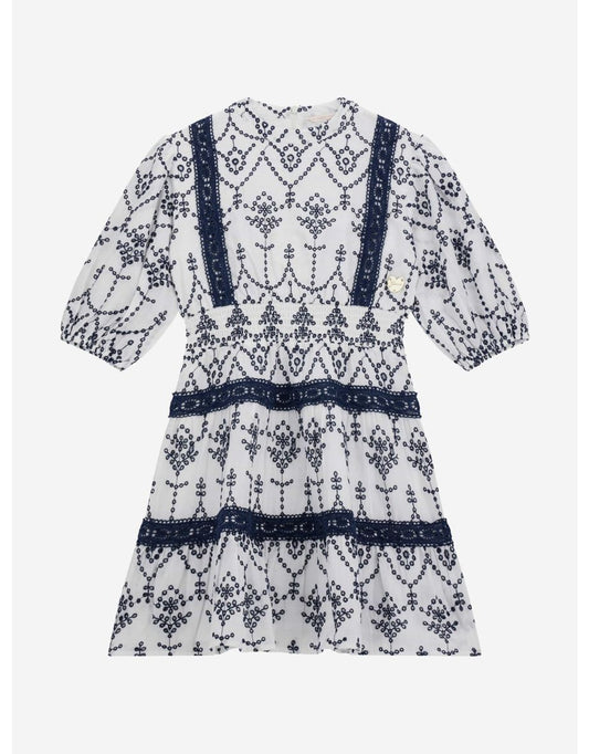Vestito da bambina in pizzo bianco con occhielli