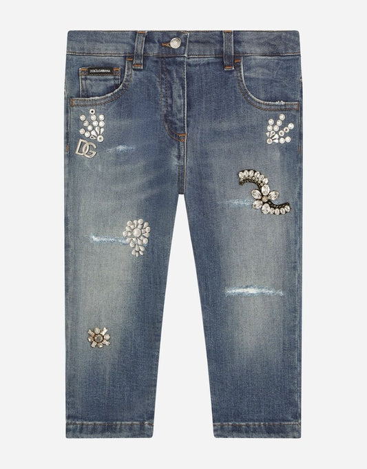 Jeans in denim elasticizzato con decorazioni in rilievo