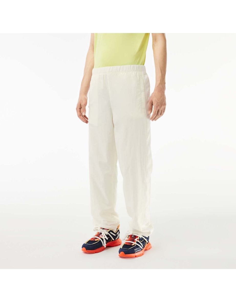Pantaloni Lacoste da uomo dal taglio rilassato a righe color crema