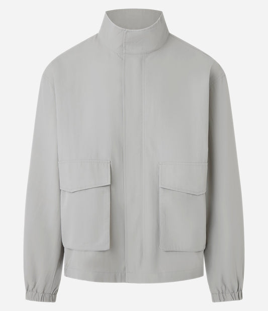 Giacca in poliammide con collo alto e tasca multiuso in grigio