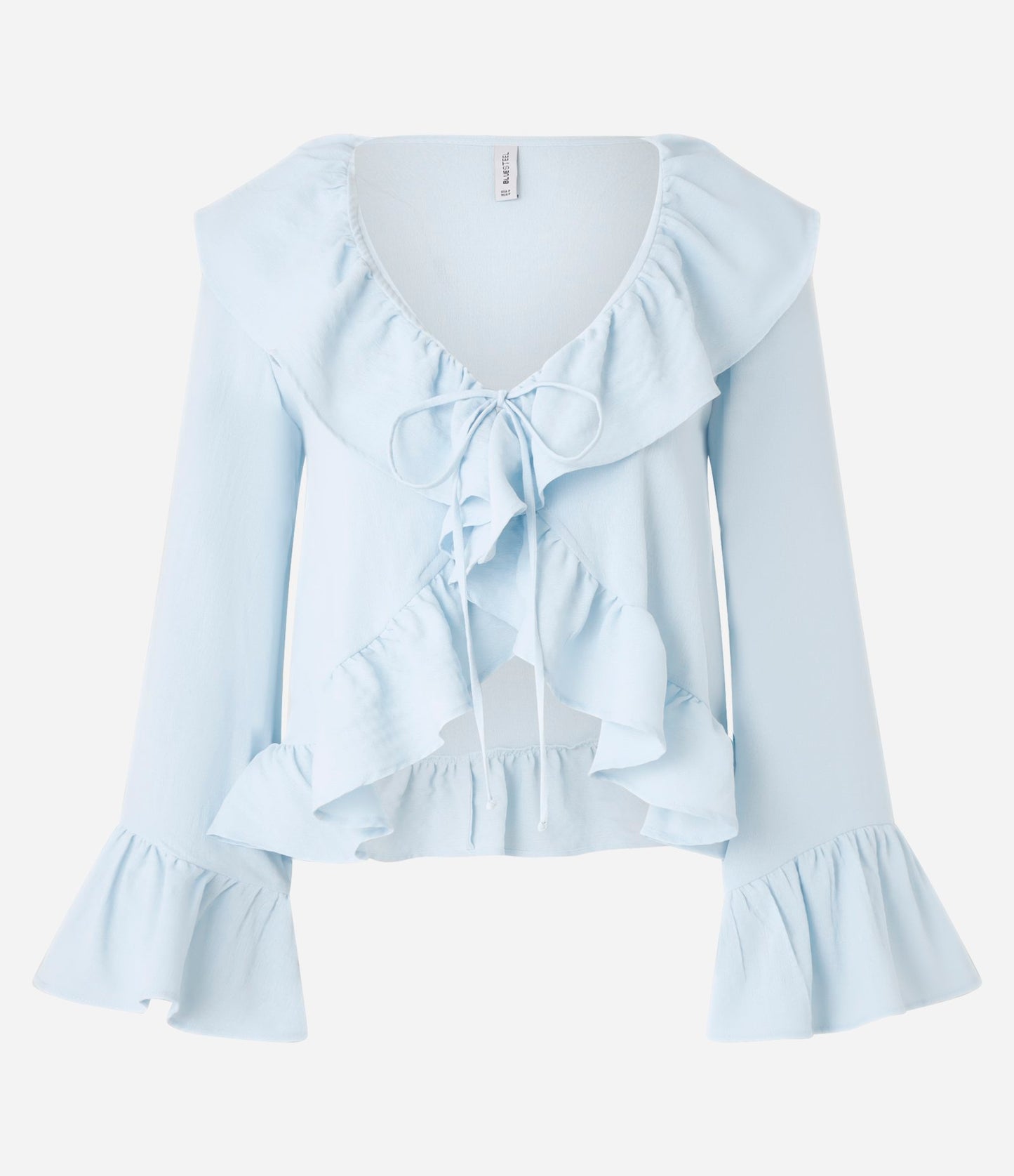 Blusa azul de crepé con volante y lazo delantero