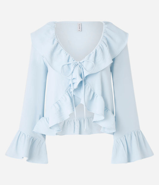 Blusa azul de crepé con volante y lazo delantero
