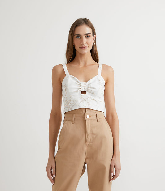 Camicetta cropped in poliestere con dettaglio sul busto e stampa di fogliame bianco