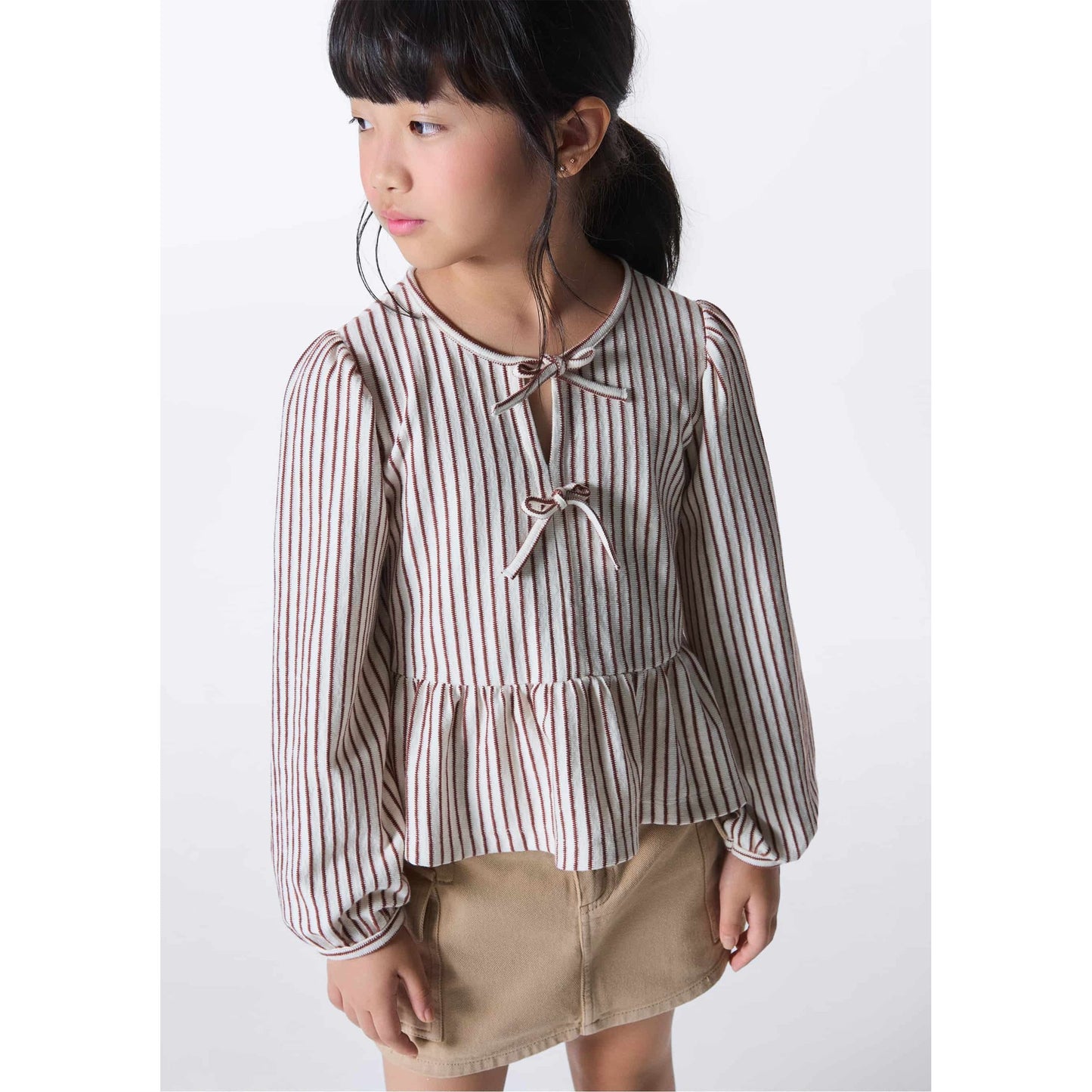 Blusa de niña en tejido texturizado teñido en hilo