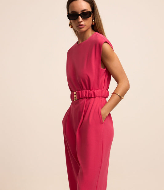 Tuta in crepe con chiusura a zip sul retro e cintura rosa