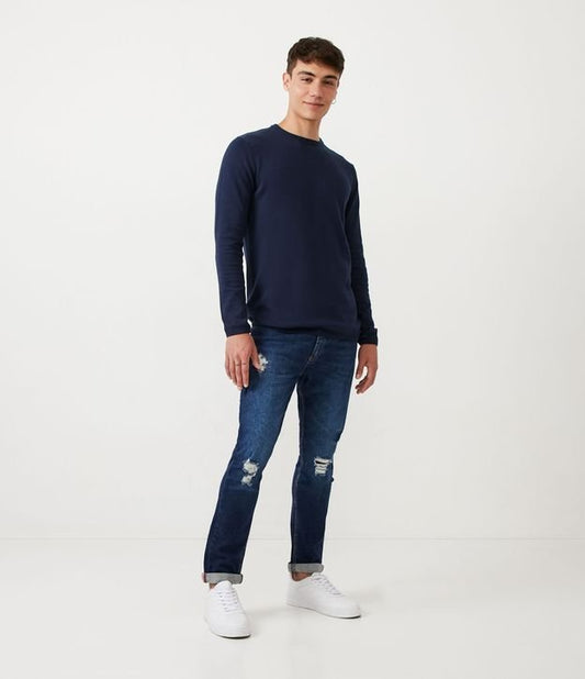 Jeans skinny con dettagli anticati e orlo arrotolato in blu
