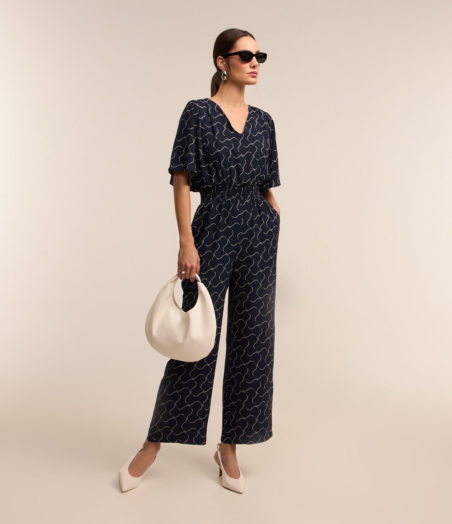 Long Jumpsuit in Airflow Fabric with Smocked Waist and Dark Blue Abstract Print