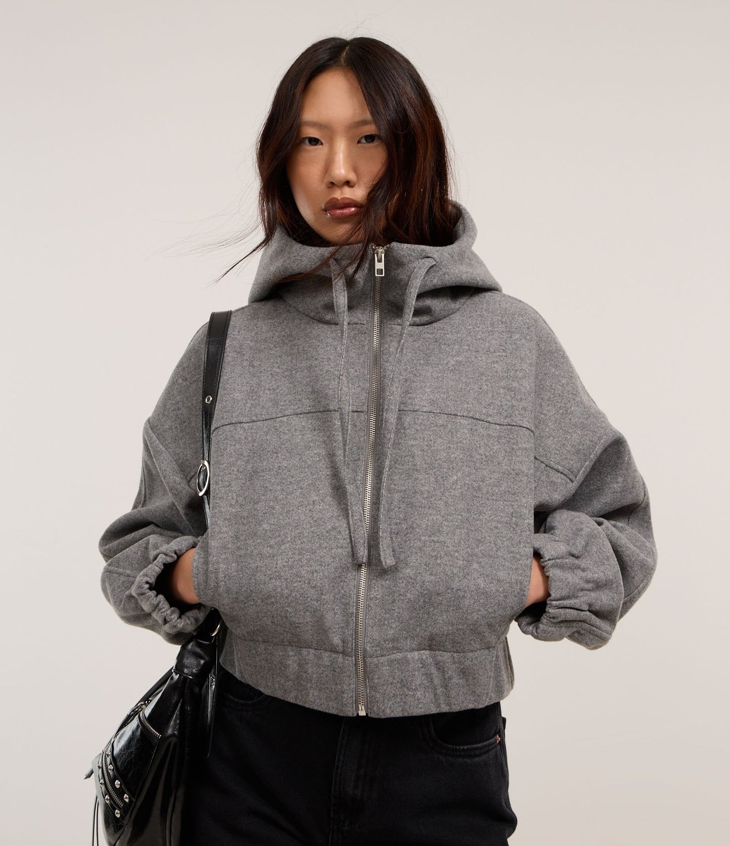 Giacca corta grigia in Polivelour con cappuccio