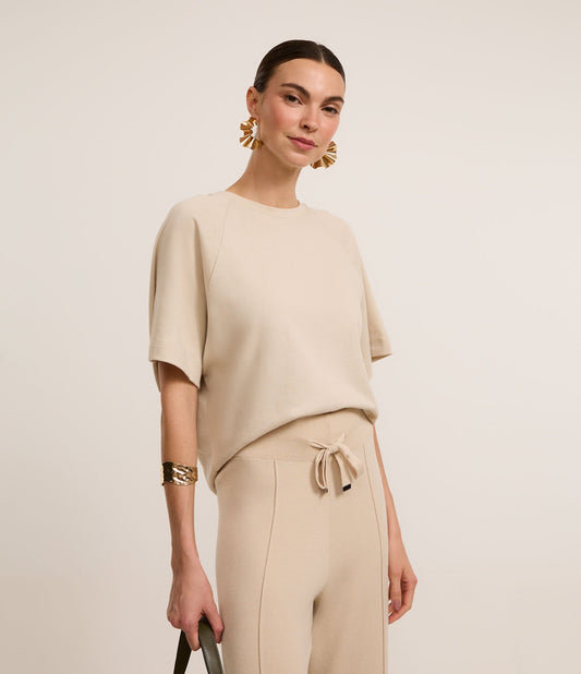 Camicetta in cotone beige con maniche ampie