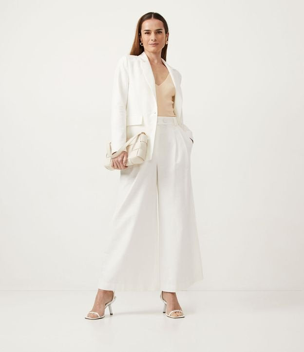 Calça de algodão de perna larga com cós largo e pregas frontais em branco