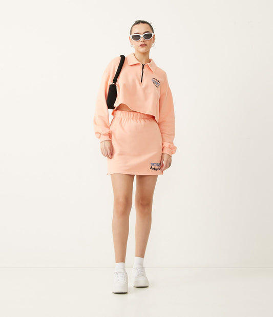 Short Skirt in Pink Sweatshirt Fabric with "Worst Behavior" Lettering