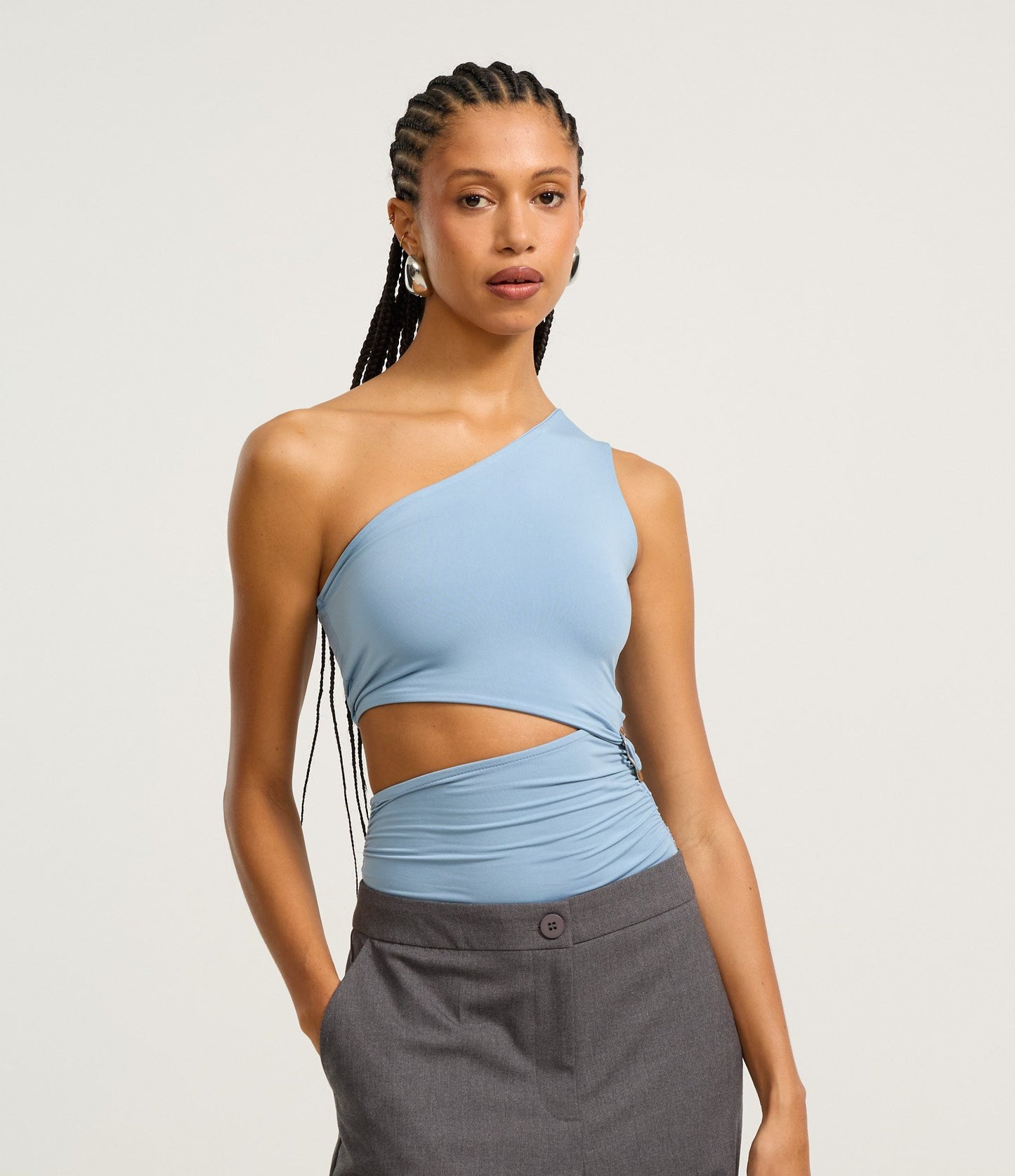 Body senza maniche in microfibra blu con design cut-out