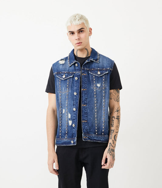 Chaleco vaquero azul lavado mármol con pinchos