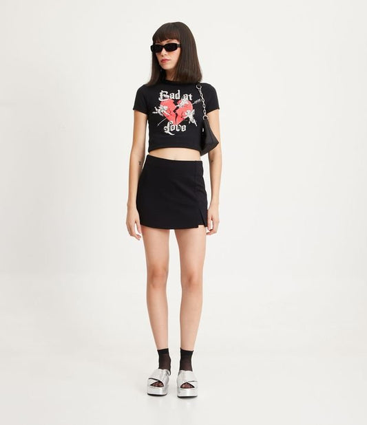 Gonna corta in maglia rom con piccolo spacco - Nero