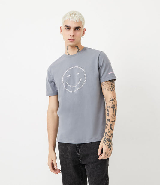 Maglietta in cotone grigio con stampa del sorriso a spine