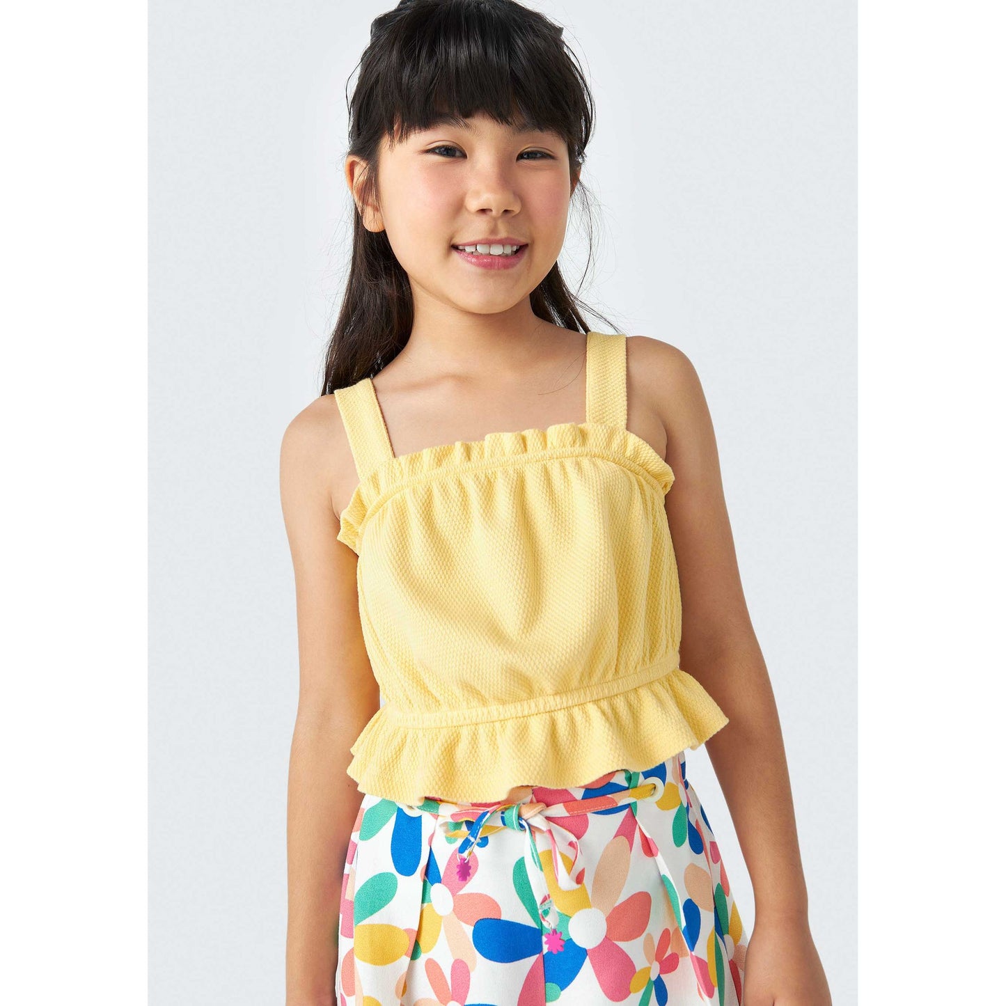 Camiseta de tirantes con volantes para niña