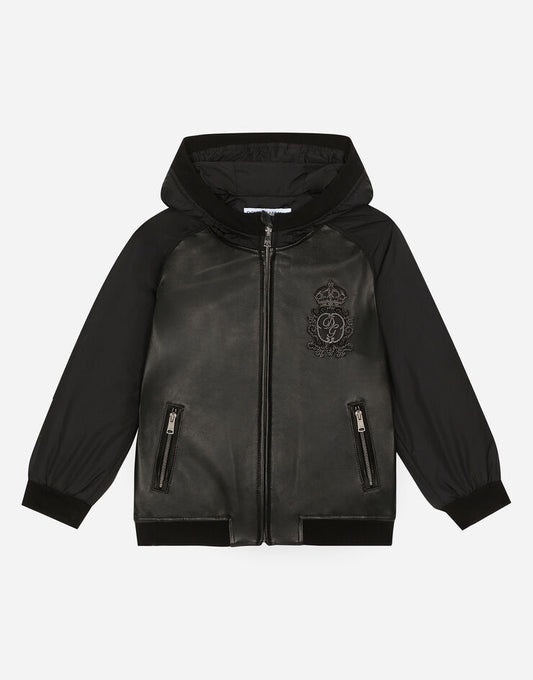 Cazadora bomber de piel y nylon con capucha y parche con logotipo